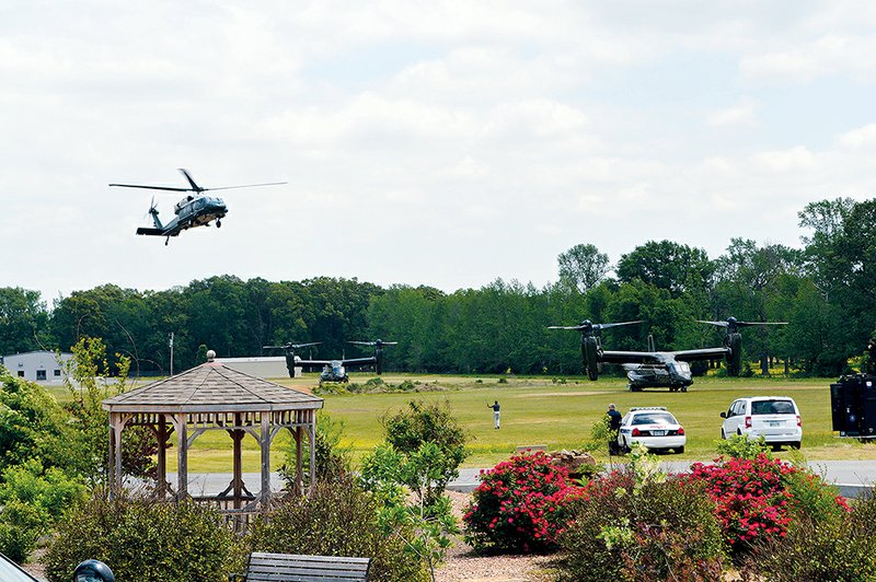 A helicopter lands at the Vilonia Middle School field Wednesday, one of four helicopters, including two Osprey (pictured), that arrived. President Barack Obama was in an identical Marine One chopper, which landed last.