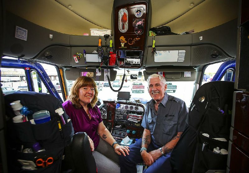 5/2/14
Arkansas Democrat-Gazette/STEPHEN B. THORNTON
Truck driver Toni Chandler, left, and her husband Les Paugh Jr. now live out of her CalArk trucking company truck.  Chandler drives and her husband just rides along. FOR CHRIS BAHN STORY