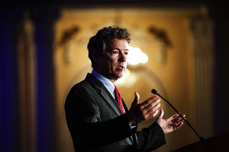 Kentucky Senator Rand Paul address attendees during the Republican National Committee spring meeting at the Peabody hotel in Memphis, Tenn., on Friday, May 9, 2014.  Paul urged members to rethink policies on national security and drug prosecutions (AP Photo/The Commercial Appeal, William DeShazer)