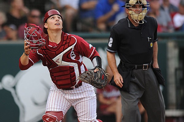 Arkansas catcher Alex Gosser tracks a fly ball against Texas A&M during the second inning Friday, May 9, 2014, at Baum Stadium in Fayetteville.