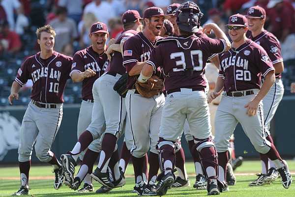 Texas A&M players celebrate after their 10-inning, 6-5 win over Arkansas Sunday, May 11, 2014, at Baum Stadium.