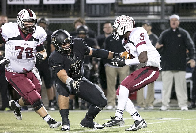 SPECIAL TO NWA MEDIA DAVID J. BEACH Javier Carbonell, center, shown going for a tackle against Springdale High&#8217;s Cua Rose during an Oct. 31 game in Tiger Stadium, will be one of several Bentonville returning starters who will see limited practice time during the Tigers&#8217; spring workouts, which start Wednesday.