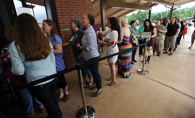 A line forms to enter the Washington County Courthouse Monday, May 12, 2014, as same-sex couples wait to file for marriage licenses in Fayetteville.