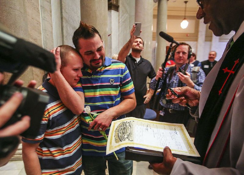 5/12/14
Arkansas Democrat-Gazette/STEPHEN B. THORNTON
James Paulus, left, and his husband Christopher Shelton embrace through the tears as Judge Wendell Griffen fills out their marriage license after they were wed in the rotunda of the Pulaski County Courthouse in Little Rock, Ark. Monday May 12, 2014.
PLEASE OUT; APNewsNow-Little Rock market, TV-Little Rock market, Radio-Little Rock market, Online-Nationwide market, Arkansas Business, Arkansas Times.
