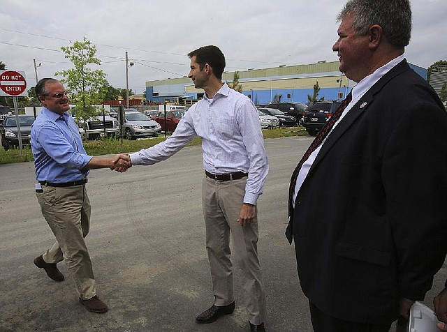 Arkansas Democrat-Gazette/STATON BREIDENTHAL --5/12/14-- U.S. Sen. Mark Pryor (left) shakes hands with  U.S. Rep. Tom Cotton (middle) as he arrives Monday morning to tour the Welspun Tubular facility in Little Rock with Welspun President David Delie. (Please Out the following: APNewsNow-Little Rock market, TV-Little Rock market, Radio-Little Rock market, Online-Nationwide market, Arkansas Business, Arkansas Times.)
