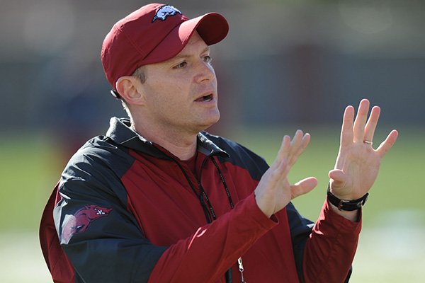 Arkansas defensive coordinator Robb Smith directs his players during practice Thursday, March 20, 2014, at the UA practice field in Fayetteville.