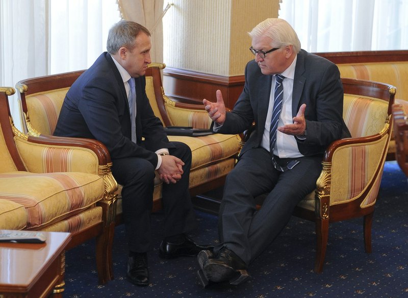 German Foreign Minister Frank-Walter Steinmeier, right, talks with his Ukrainian counterpart Andrii Deshchytsia during his visit to Kiev, Ukraine, on Tuesday, May 13, 2014. Steinmeier flew to Ukraine on Tuesday to help start talks between the Ukrainian government and its foes after the declaration of independence by two eastern region. 