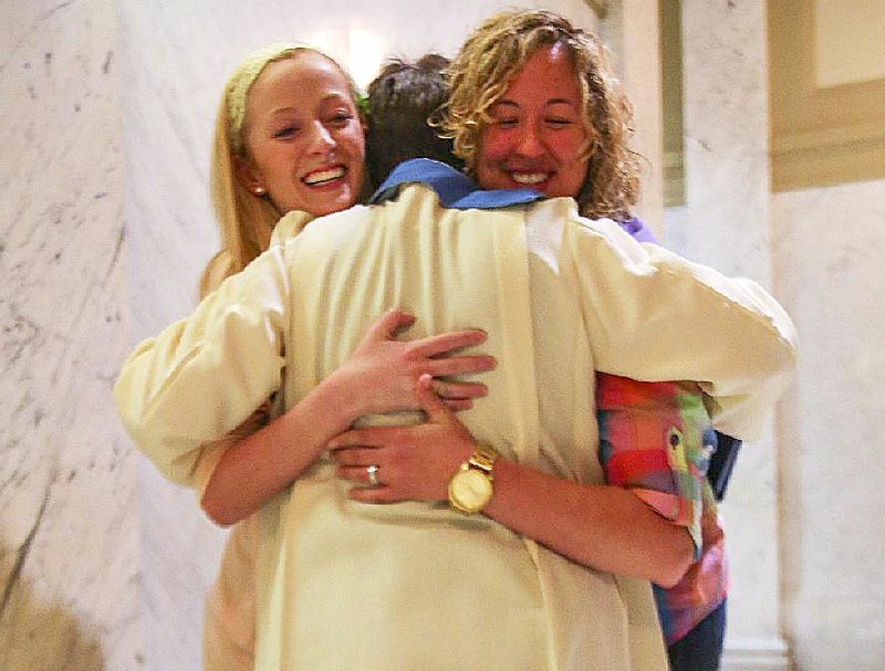 5/12/14
Arkansas Democrat-Gazette/STEPHEN B. THORNTON
The Rev. Jennie Barrington, center, gets bear hug from Malleri Rhodes, left, and Jenna LaMaster, right, after Barrington married the couple at the Pulaski County Courthouse in Little Rock, Ark. Monday May 12, 2014.
PLEASE OUT; APNewsNow-Little Rock market, TV-Little Rock market, Radio-Little Rock market, Online-Nationwide market, Arkansas Business, Arkansas Times.
