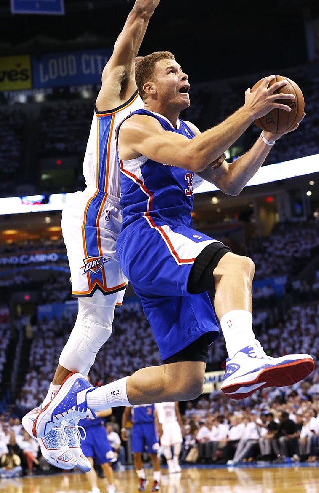 Los Angeles Clippers forward Blake Griffin (right) is fouled by Oklahoma City’s Russell Westbrook in the first quarter of the Thunder’s 105-104 victory in the NBA Western Conference semifinals. Griffin led the Clippers with 24 points and 17 rebounds. 