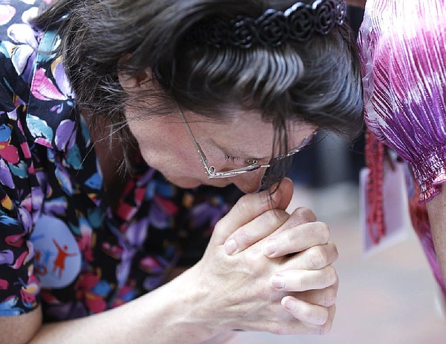 Traditional marriage supporter Barbara Kerns of Midlothain, Va., prays Tuesday outside the federal appeals court in Richmond, Va. 