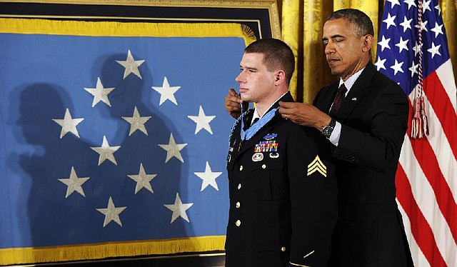 President Barack Obama awards the Medal of Honor to former Army Sgt. Kyle White during a ceremony Tuesday at the White House in Washington. 