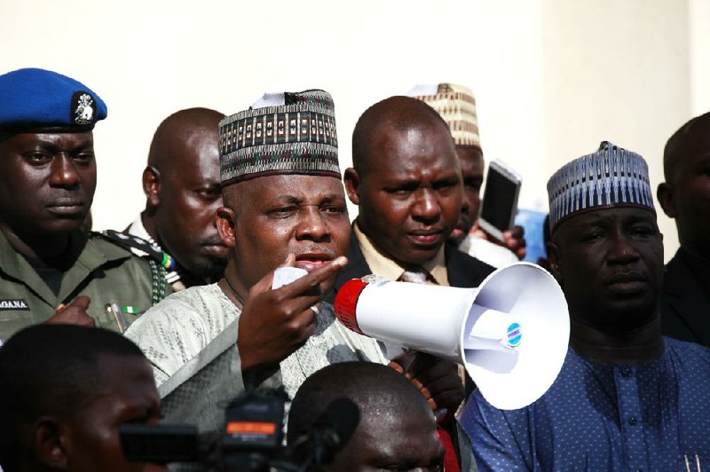 Borno state Gov. Kashim Shettima (center) on Tuesday addresses demonstrators in Abuja, Nigeria, who were calling on the government to rescue the kidnapped schoolgirls of the Chibok secondary school. 