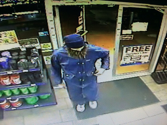 Surveillance footage shows the robbery suspect who police say possibly robbed two Rogers businesses this week.