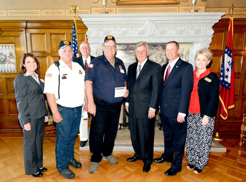 Submitted Photo Pictured in Little Rock when the grant was awarded are: Cassie Elliott, Charlie Orr, ARDC Commissioner Lonnie Turner, Chief John Varner, Governor Mike Beebe, DRS Director John Andrews and ARDC Chair Lynn Hawkins. Not pictured are Senator Jim Hendren and Representative Mary Slinkard.