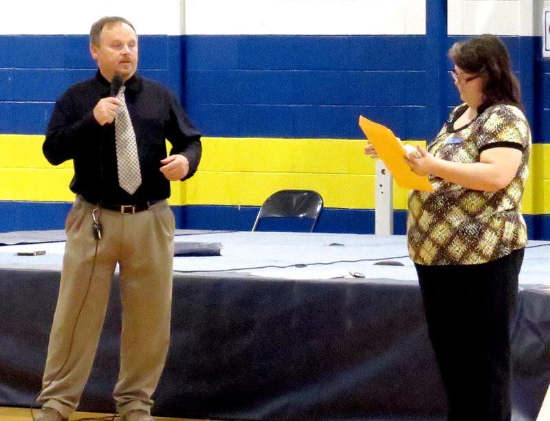 Photo by Mike Eckels In coming high school principal Toby Conrad (left) and outgoing principal Deborah Coffer address question during the May 8th assembly at Peterson Gym in Decatur. This was the first meeting between the Conrad and the student body.