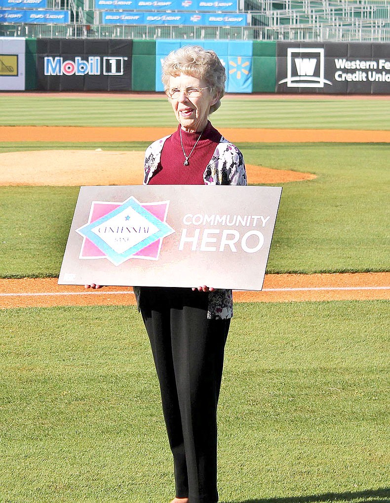 Photograph submitted Dott Webb of Pea Ridge was honored as a &#8220;Community Hero&#8221; award Friday at the Naturals game in Arvest Ball Park for her work with the Benton County Sunshine School. &#8220;Mother has taught there for over 50 years,&#8221; Kerrie Webb Smith, her daughter, said. In honor of her and representing Pea Ridge, Rick Neal, school superintendent, threw out the first pitch.