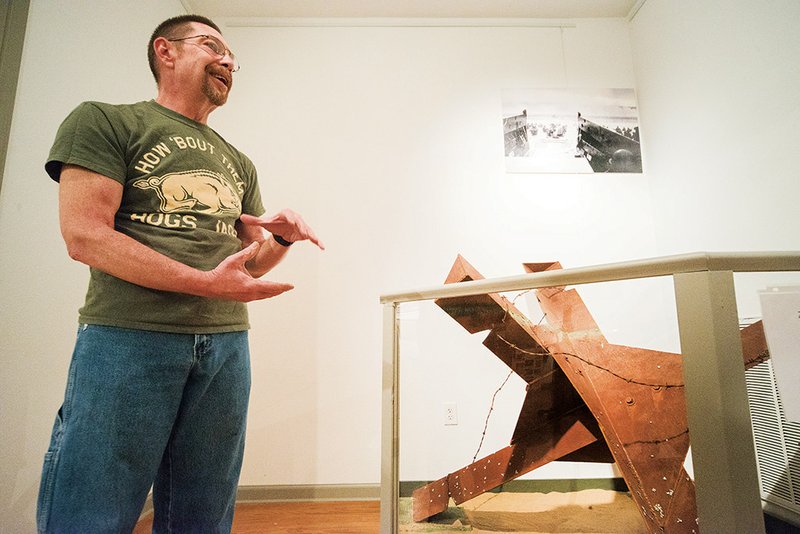 Standing in front of a model of a Czech hedgehog anti-tank obstacle he constructed, Robert Houston talks about the D-Day exhibit he is working on to display at the Jacksonville Museum of Military History.
