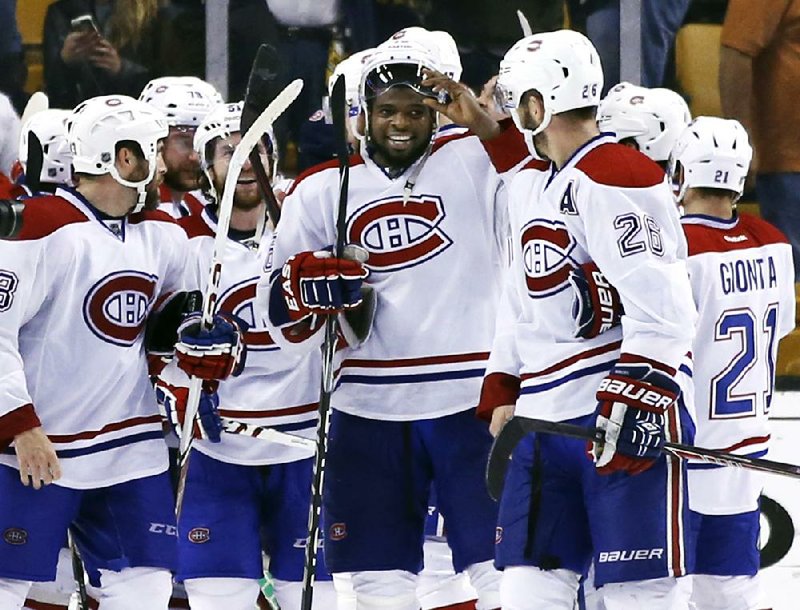 Defenseman P.K. Subban (center) celebrates with teammates after the Montreal Canadiens defeated the Boston Bruins on Wednesday night in Game 7 of their NHL playoff series. 