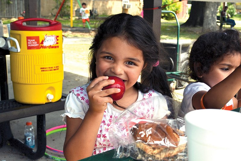 Children take part in the summer feeding program at Kensett Park in White County last year. Several counties — including Izard and Stone — did not have feeding programs in 2013, but the Arkansas Hunger Relief Alliance has made contacts in those counties to remedy the problem before school lets out for the summer.