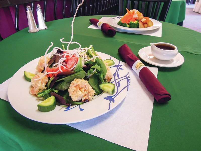 Alternative dishes served include the Shrimp Salad with breaded large shrimp and sesame dressing (foreground) and steamed salmon stuffed with shrimp and crab meat (background).