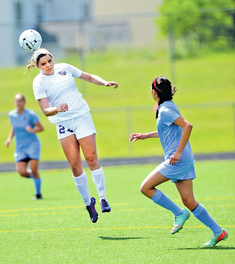  STAFF PHOTO SAMANTHA BAKER &#8226; @NWASamantha Falon Hanson, left, of Fayetteville heads the ball Thursday as Nancy Mendoza of Fort Smith Southside defends during the 7A-West Conference championship at Tiger Athletic Complex in Bentonville. Fayetteville won, 3-0.