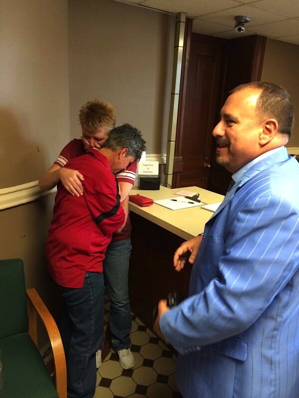 Hilda Jones and Kerin Hartsell embrace Friday afternoon, May 16, 2014, after being issued a marriage license at the Pulaski County Courthouse just moments before the state Supreme Court stayed a ruling that overturned the state's ban on gay marriages. 