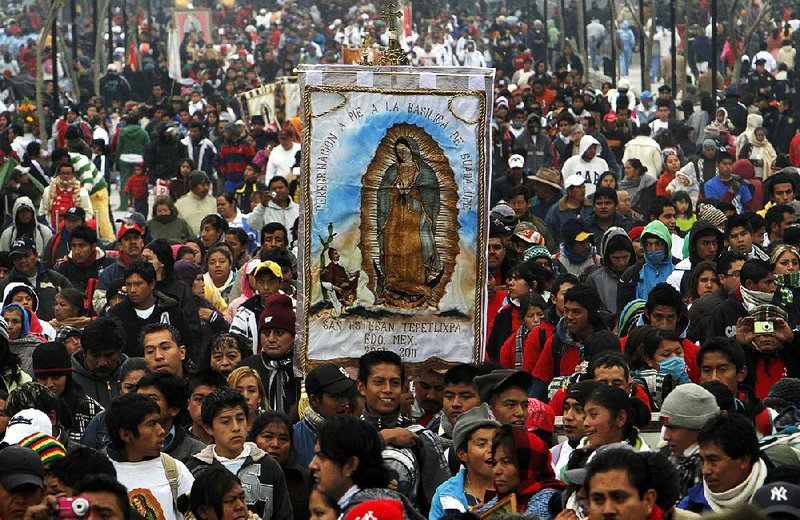 Pilgrims cary an image of Our Lady of Guadalupe toward the Basilica of the Virgin of Guadalupe in Mexico City. Hispanic Catholics, according to a new Pew survey, are leaving the church in increasing numbers.