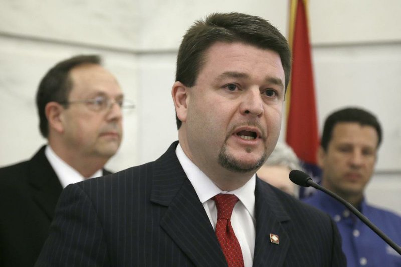 FILE — Sen. Jason Rapert, R-Conway, center, speaks at a news conference at the Arkansas state Capitol in Little Rock, Ark., Friday, April 11, 2014. A resolution by Rapert urging the state Supreme Court to uphold a ban on same-sex marriage was blocked by lawmakers Friday. 