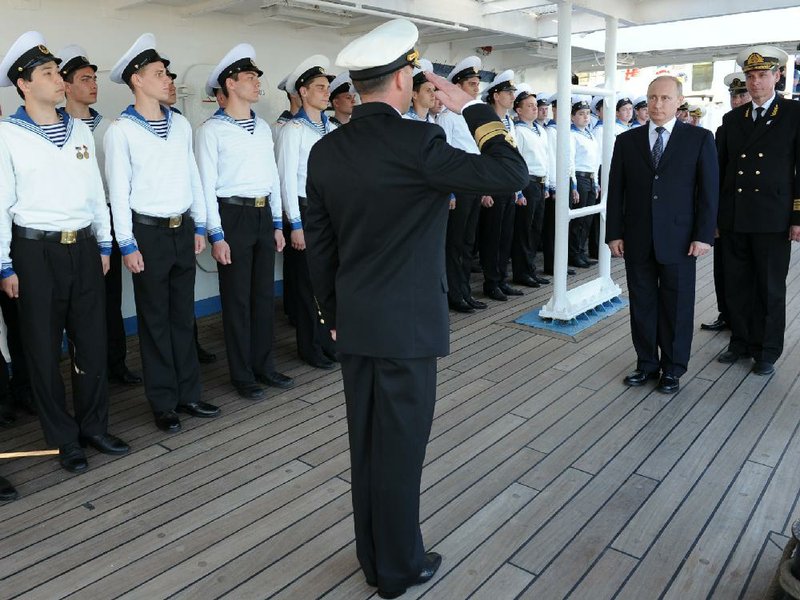 Russian President Vladimir Putin (second from right) visits the Mir tall ship Thursday in Sochi. Putin said in a letter Thursday that Russia will deliver gas to Ukraine only if it pays in advance starting next month. 