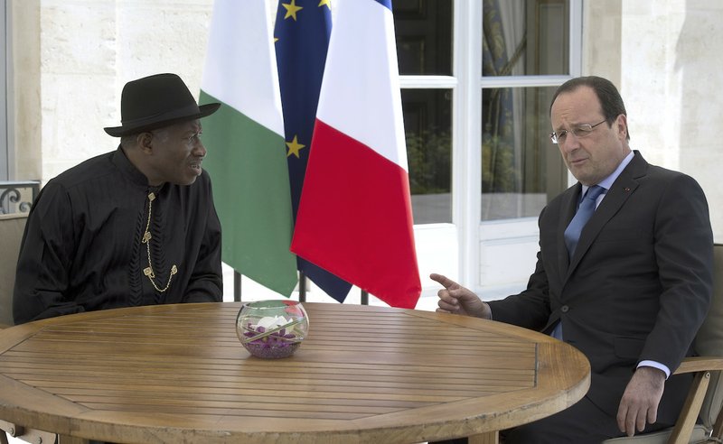 French President Francois Hollande, right, poses with Nigeria President Goodluck Jonathan during the "Paris' Security in Nigeria summit", at the Elysee Palace, in Paris, Saturday, May 17, 2014. Leaders from Africa as well as officials from the United States, Britain and France meet to coordinate a response to Boko Haram, the fundamentalist group that abducted more than 300 girls and is accused of hundreds of deaths in the past year alone.