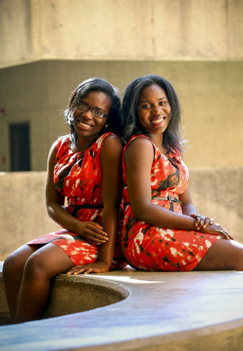 5/16/14
Arkansas Democrat-Gazette/STEPHEN B. THORNTON
Dolapo Odeniyi, left, and her twin sister Bukola Odeniyi have taken virtually all classes together leading up to Saturday's graduation from UALR. WITH JEANNIE ROBERTS WEEKEND GRADUATION STORY