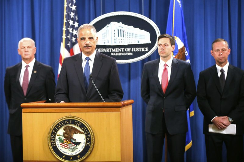 Attorney General Eric Holder, Assistant Attorney General for National Security John Carlin, second right, U.S. Attorney for Western District of Pennsylvania David Hickton, left, and FBI Executive Associate Director Robert Anderson, right, speak at a news conference at the Justice Department in Washington, Monday, May 19, 2014. Holder was announcing that a U.S. grand jury has charged five Chinese hackers with economic espionage and trade secret theft, the first-of-its-kind criminal charges against Chinese military officials in an international cyber-espionage case. 
