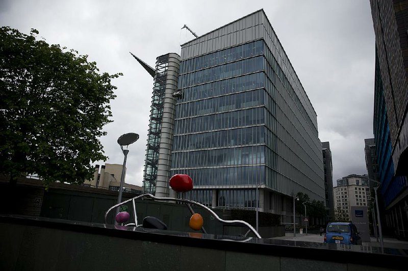 FILE - This Friday May 2, 2014 file photo shows an exterior view of the Two Kingdom Street building which houses the headquarters of AstraZeneca, in the Paddington area of London. The board of AstraZeneca has rejected the improved $119 billion takeover offer from U.S. drugmaker Pfizer, Monday May 19, 2014, a decision that has caused a sharp slide in the U.K. company's share price as investors think it effectively brings an end to the protracted and increasingly bitter takeover saga. (AP Photo/Matt Dunham, File)