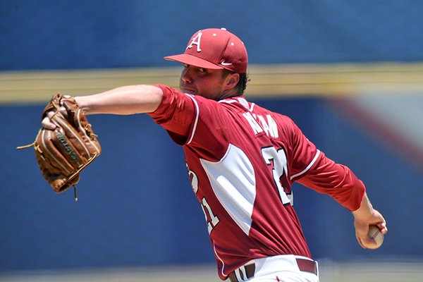 Arkansas pitcher Trey Killian fires a pitch in the second inning of Tuesday afternoon's game against Texas A&M in the 2014 SEC baseball tournament at the Hoover Met in Hoover, Ala.