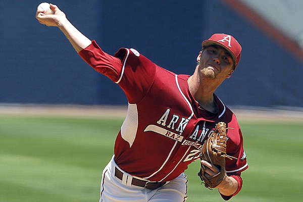 Arkansas' Trey Killian (21) pitches against Texas A&M in the first inning at the Southeastern Conference NCAA college baseball tournament on Tuesday, May 20, 2014, in Hoover, Ala. (AP Photo/Butch Dill)