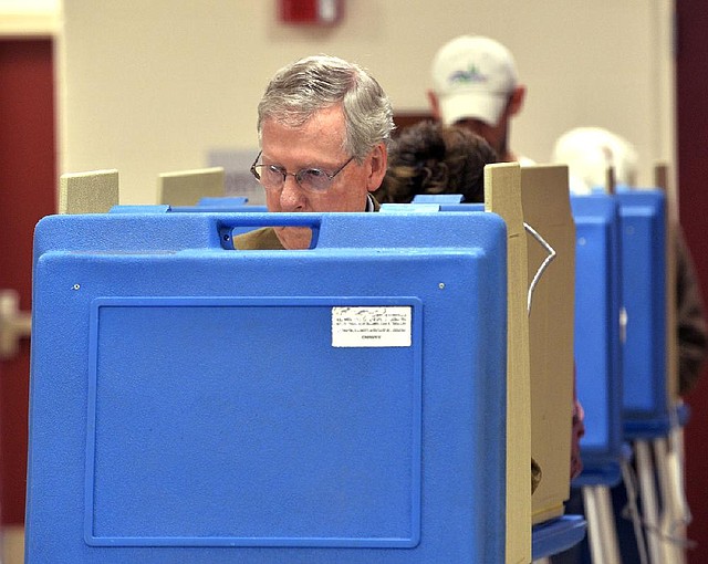 U.S. Senate Minority Leader Mitch McConnell votes Tuesday in Louisville, Ky. After coasting through the GOP primary, he likely will face strong opposition in the fall. 