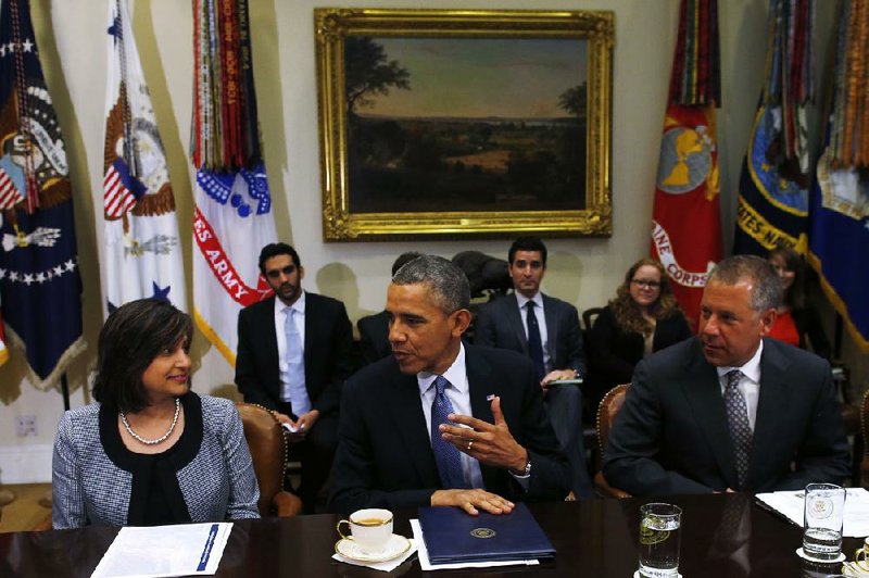 President Barack Obama talks with business leaders about creating and investing in jobs in the United States in a meeting Tuesday at the White House. 