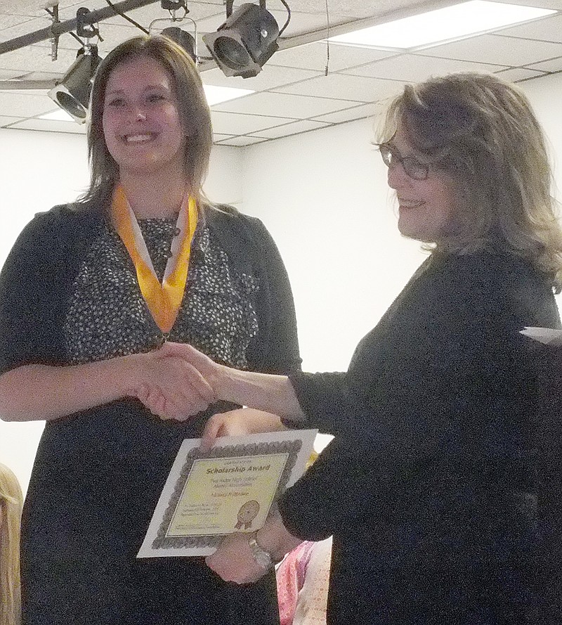 Victoria Wilkerson was presented an award by Penny Schwitters for the Pea Ridge Alumni Association.