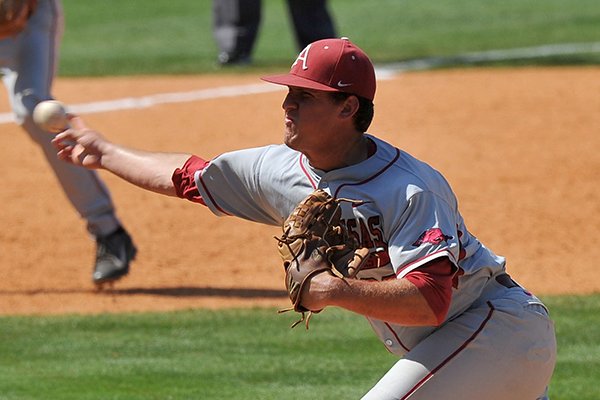 Arkansas pitcher Jacob Stone delivers a pitch during the ninth inning of a SEC Tournament game against Ole Miss on Wednesday, May 21, 2014 at Hoover Metropolitan Stadium in Hoover, Ala. 