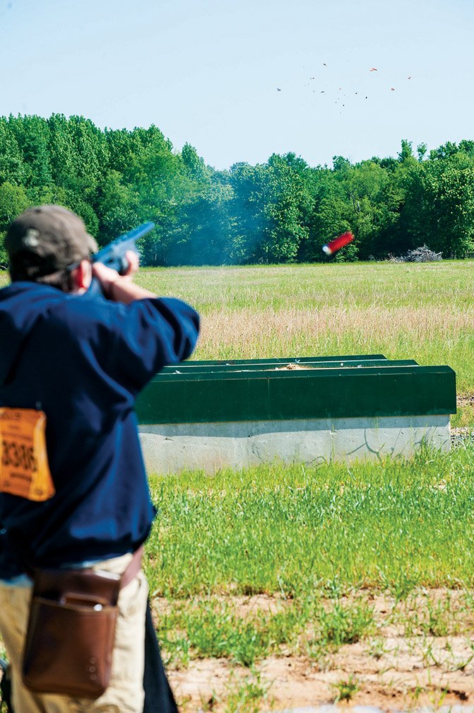 As Jacob Baker takes his shot at the skeet, his shell ejects from his shotgun during competition at the Arkansas Game and Fish Foundation Shooting Sports Complex in Jacksonville.