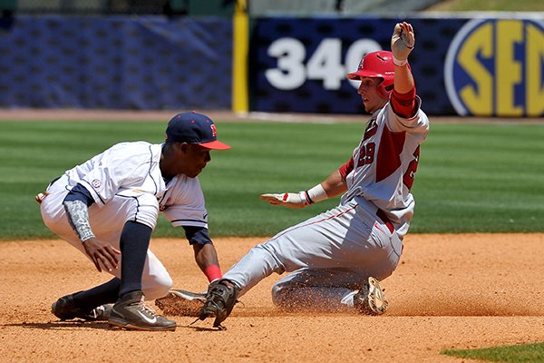 Arkansas first baseman Eric Fisher slides into second base ahead of the tag from Ole Miss shortstop Errol Robinson during the sixth inning of a SEC Tournament game on Wednesday, May 21, 2014 at Hoover Metropolitan Stadium in Hoover, Ala. 