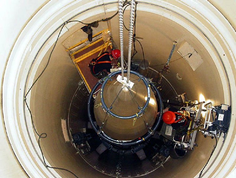 A Malmstrom Air Force Base missile maintenance team removes the upper section of an ICBM at a Montana missile site. An Air Force security team’s botched response to a simulated assault on a nuclear missile silo has prompted a blistering review and expanded training to deal with the nightmare scenario of a real attack. 