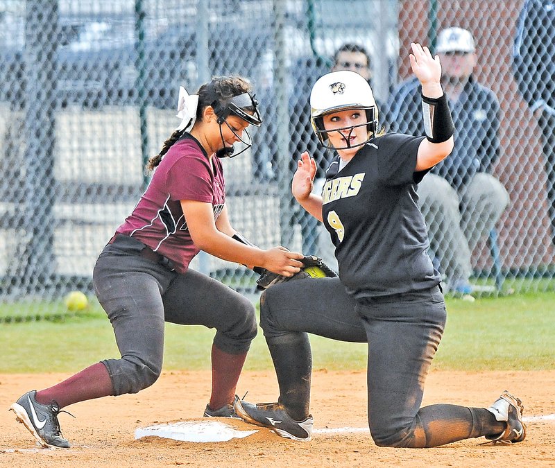  FILE PHOTO BEN GOFF Alicia Lowrey, right, of Bentonville has a team-high 34 runs batted in heading into the Class 7A State Championship game Saturday against North Little Rock.