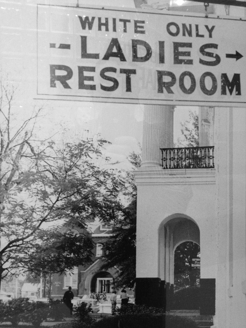 A sign at the Oxford, Miss., courthouse in the years before integration, shown in a photograph the author found displayed at Hartsfield-Jackson Atlanta International Airport as part of a Martin Luther King Jr. exhibit.
