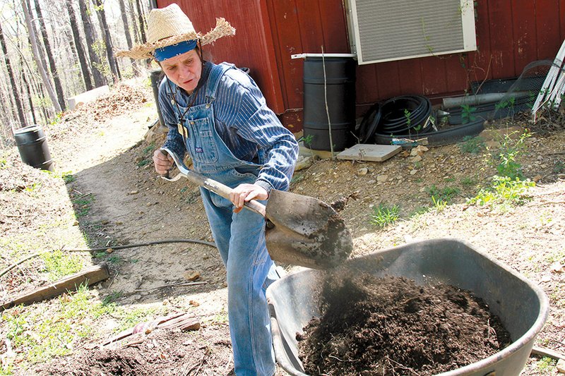 Angela Spencer/Three Rivers Edition
Tina Marie Wilcox, chief herbalist and head gardener at the Ozark Folk Center, gathers compost for some new plants at the center. Wilcox works with the on-site restaurant to gather scraps for the compost piles.