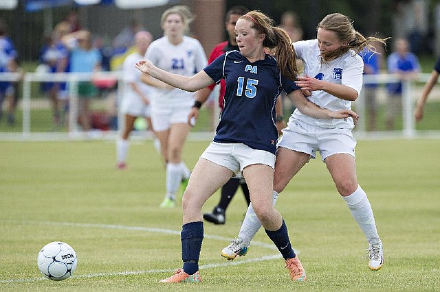 Photo By Wesley Hitt --05/23/2014-- Anna Lants #15 of the Pulaski Academy Lady Bruins keeps the ball away from Shelby McGarrah #4 of the Harrison Lady Golden Goblins at the 2014 5A Girls High School Soccer Finals at Razorback Field in Fayetteville, Arkansas.
