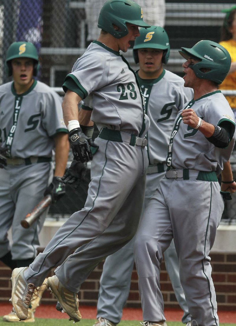 Southeastern Louisiana’s Jameson Fisher (left) and Jacob Steward celebrate at home plate after both scored on a double in the eighth inning of their 9-4 victory over Central Arkansas on Saturday in the Southland Conference championship game in Conway. 