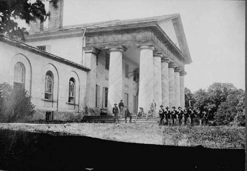 The east front of Arlington House, Robert E. Lee&apos;s beloved home, with Union soldiers on the lawn, is seen on June 28, 1864. The estate became a cemetery because Union Gen. Montgomery C. Meigs detested Lee and wanted to make sure the Lees never returned to their home. Illustrates ARLINGTON-HISTORY (category l), by Linda Wheeler, special to The Washington Post. Moved Thursday, May 22, 2014. (MUST CREDIT: National Archives and Records Administration)