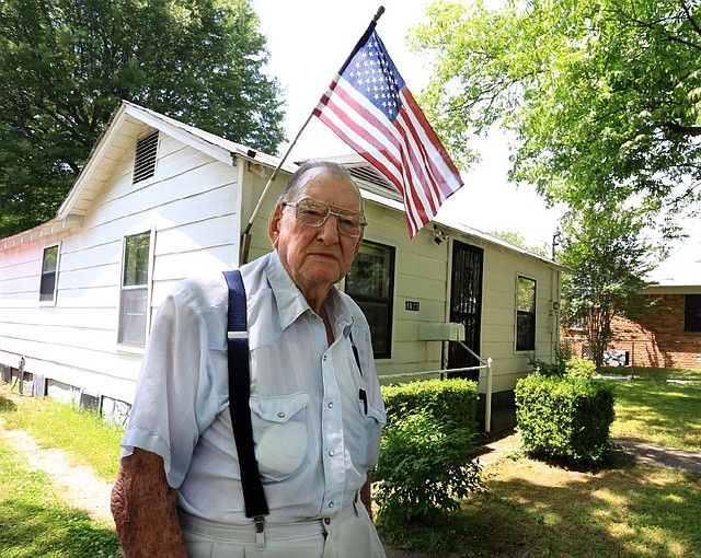 Arkansas Democrat-Gazette/RICK MCFARLAND --05/23/14--  Kenneth D. Evans, 94, outside his North Little Rock home Friday. Evans, as army infantryman, came ashore with the second wave of troops at Omaha Beach during the D-Day invasion of WWII on June 6, 1945.