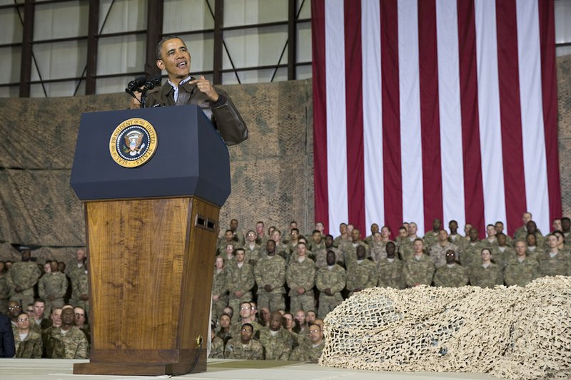 This May 25, 2014, file photo shows President Barack Obama speaking during a troop rally after arriving at Bagram Air Field for an unannounced visit, north of Kabul, Afghanistan. Senior U.S. administration officials say President Barack Obama will seek to keep 9,800 U.S. troops in Afghanistan after the war formally ends later this year. Nearly all of those forces are to be out by the end of 2016, as Obama finishes his second term. 